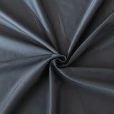 The Linenly Luxe Cotton Sateen Sheet Set in Charcoal features smooth, dark gray fabric with a subtle sheen, gathered and twisted into a central spiral to highlight its soft folds and radiating lines under gentle lighting.